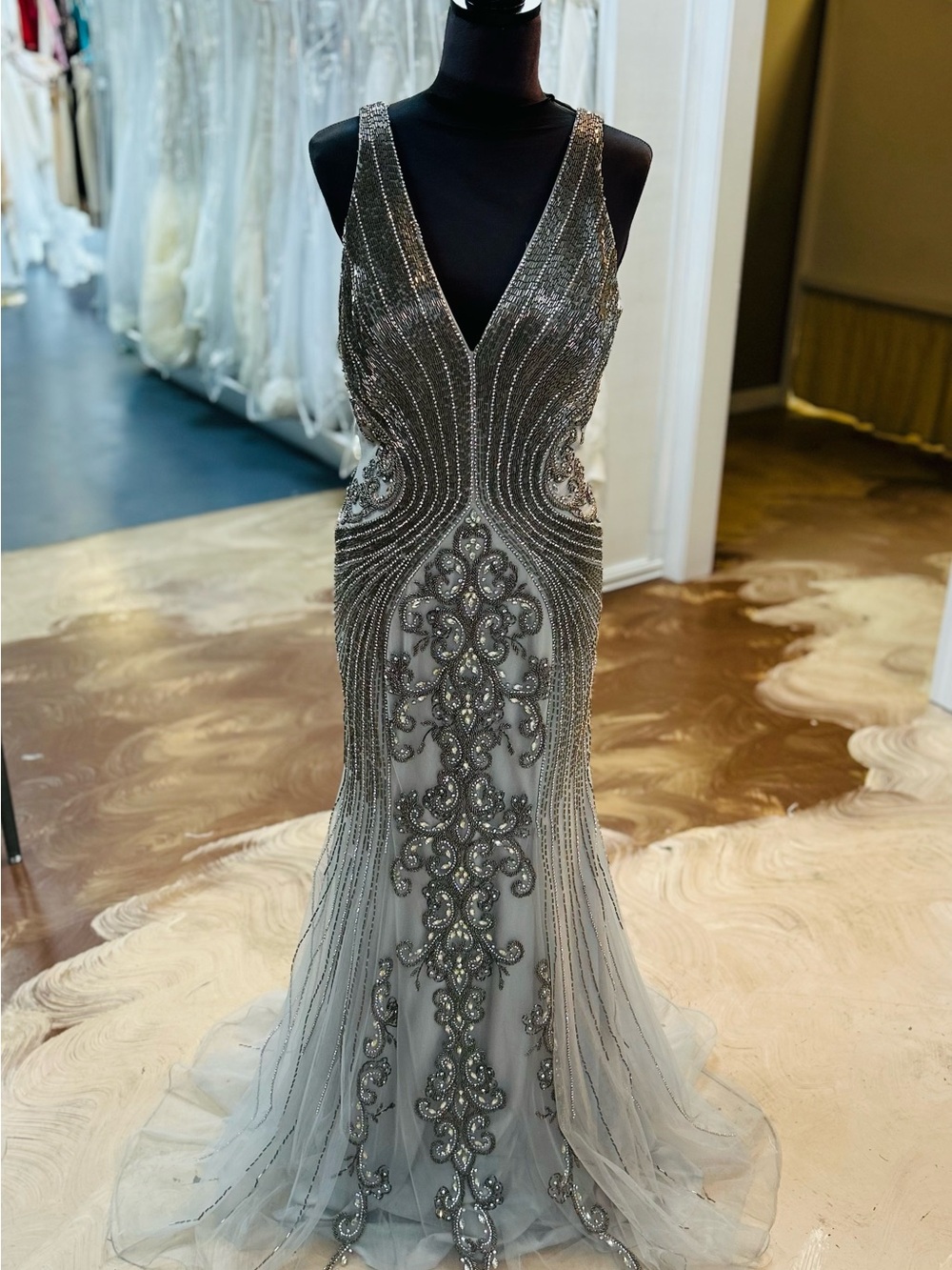 Elegant Stella Couture Silver Beaded Prom Dress with V-Neck